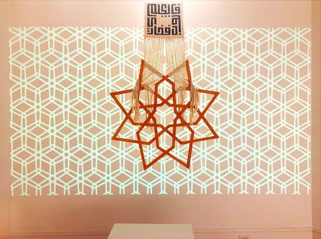 Five-fold geometric piece with pink projection