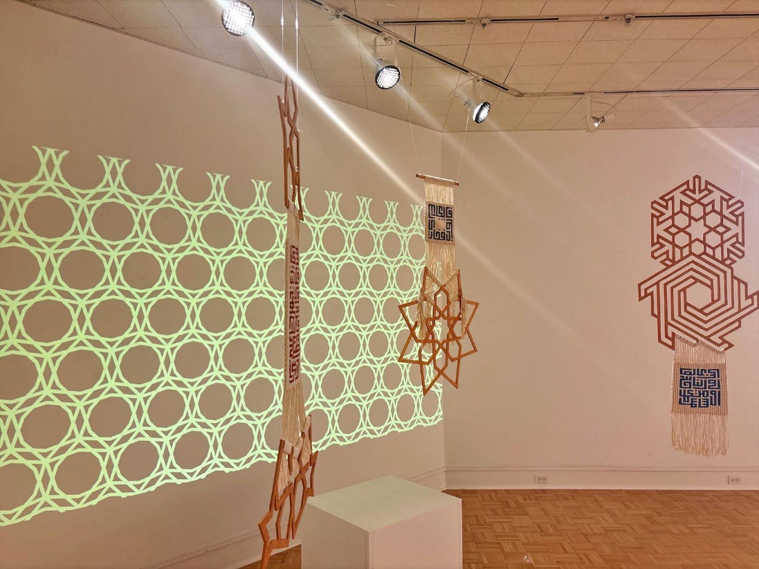 Left side of exhibition with green projection