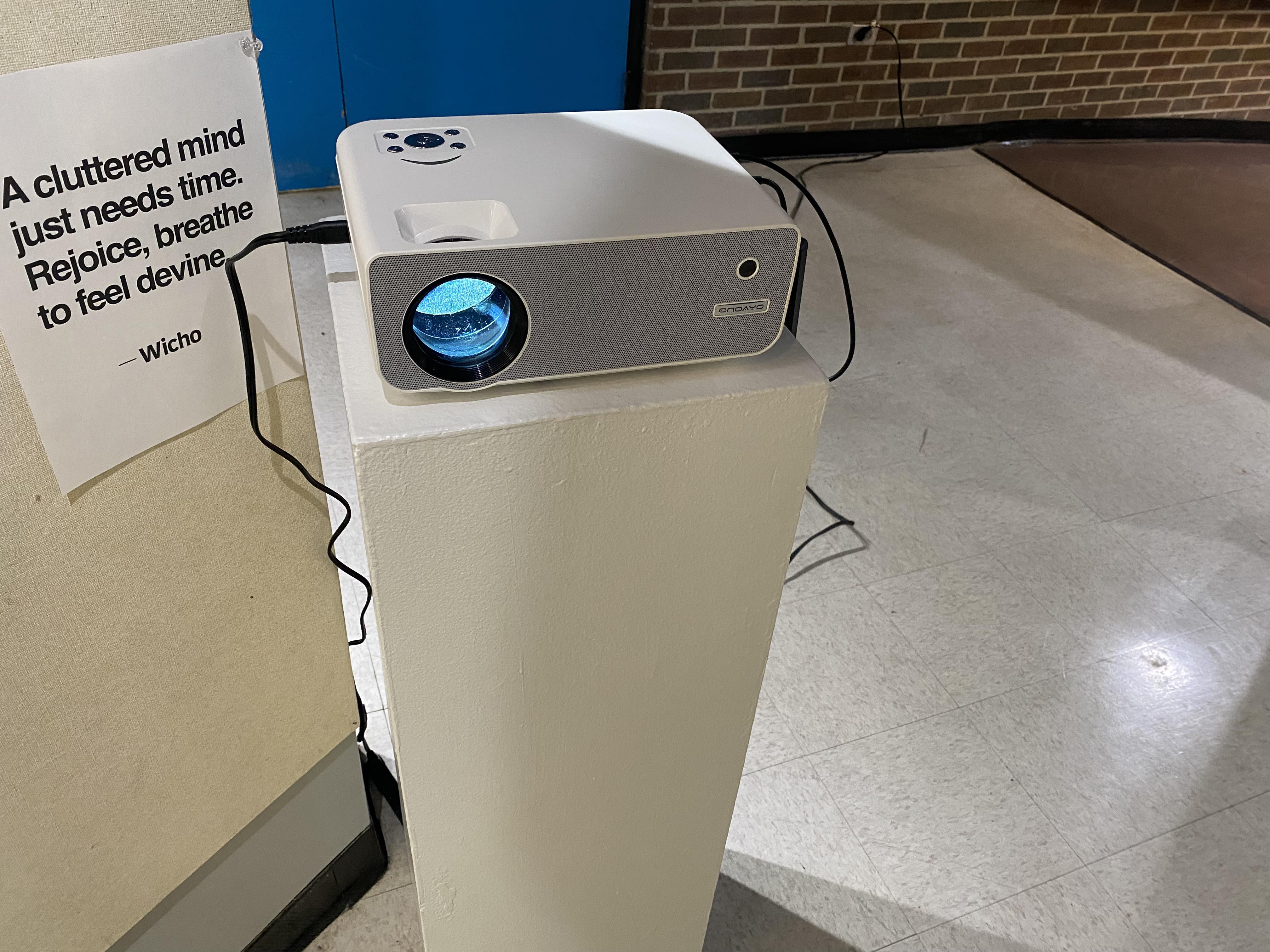 Projector on pedestal in gallery