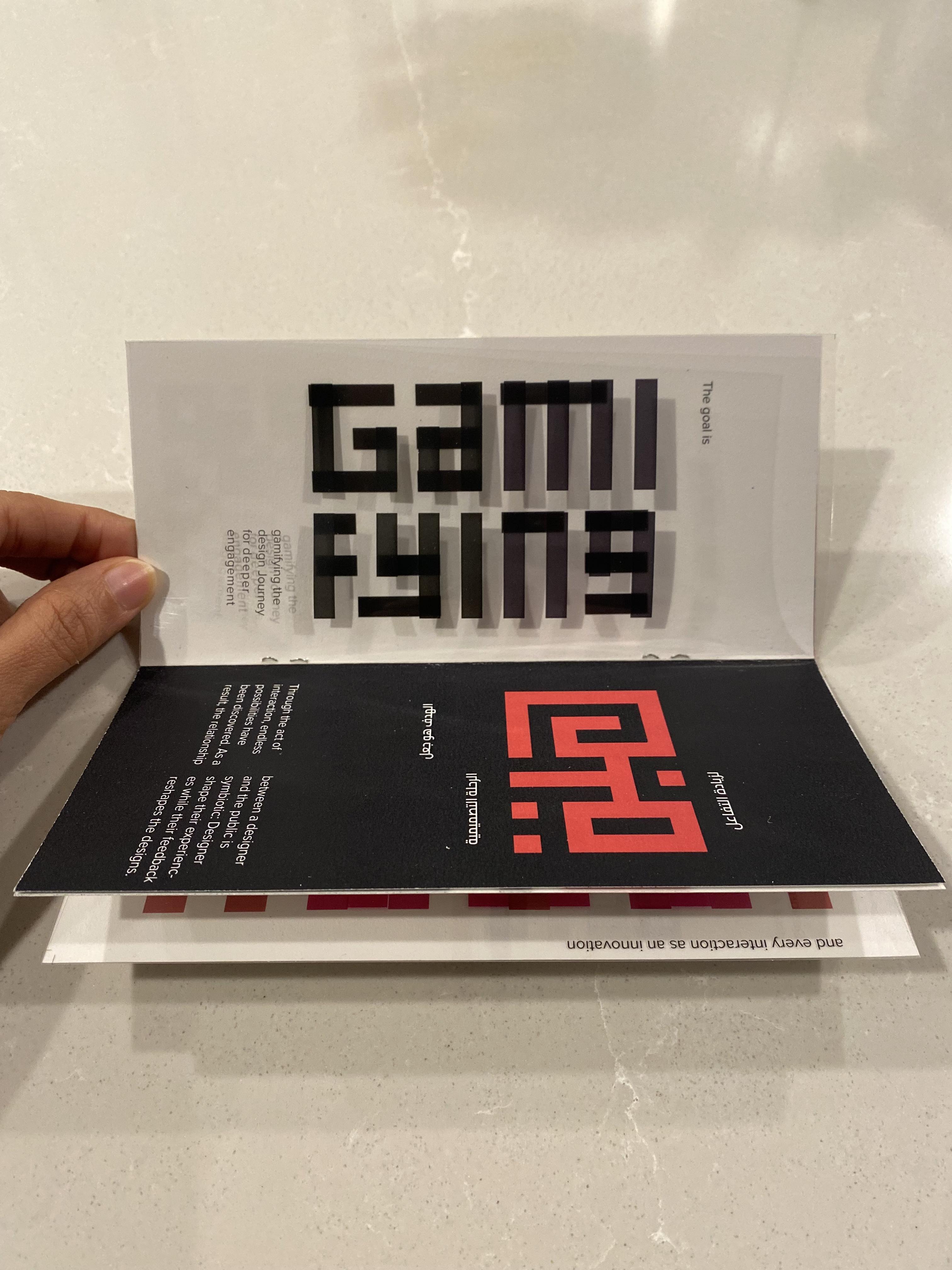 Printed Harmony zine open showing GAMIFYING spread